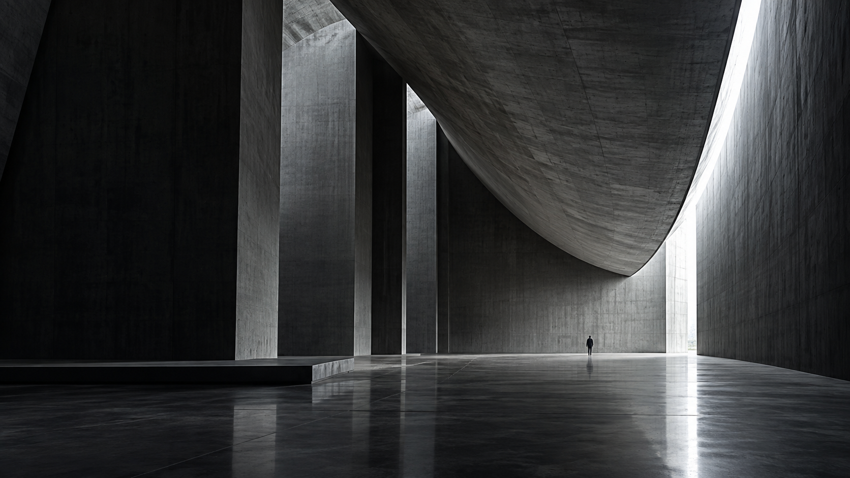 A monumental concrete space opening towards daylight