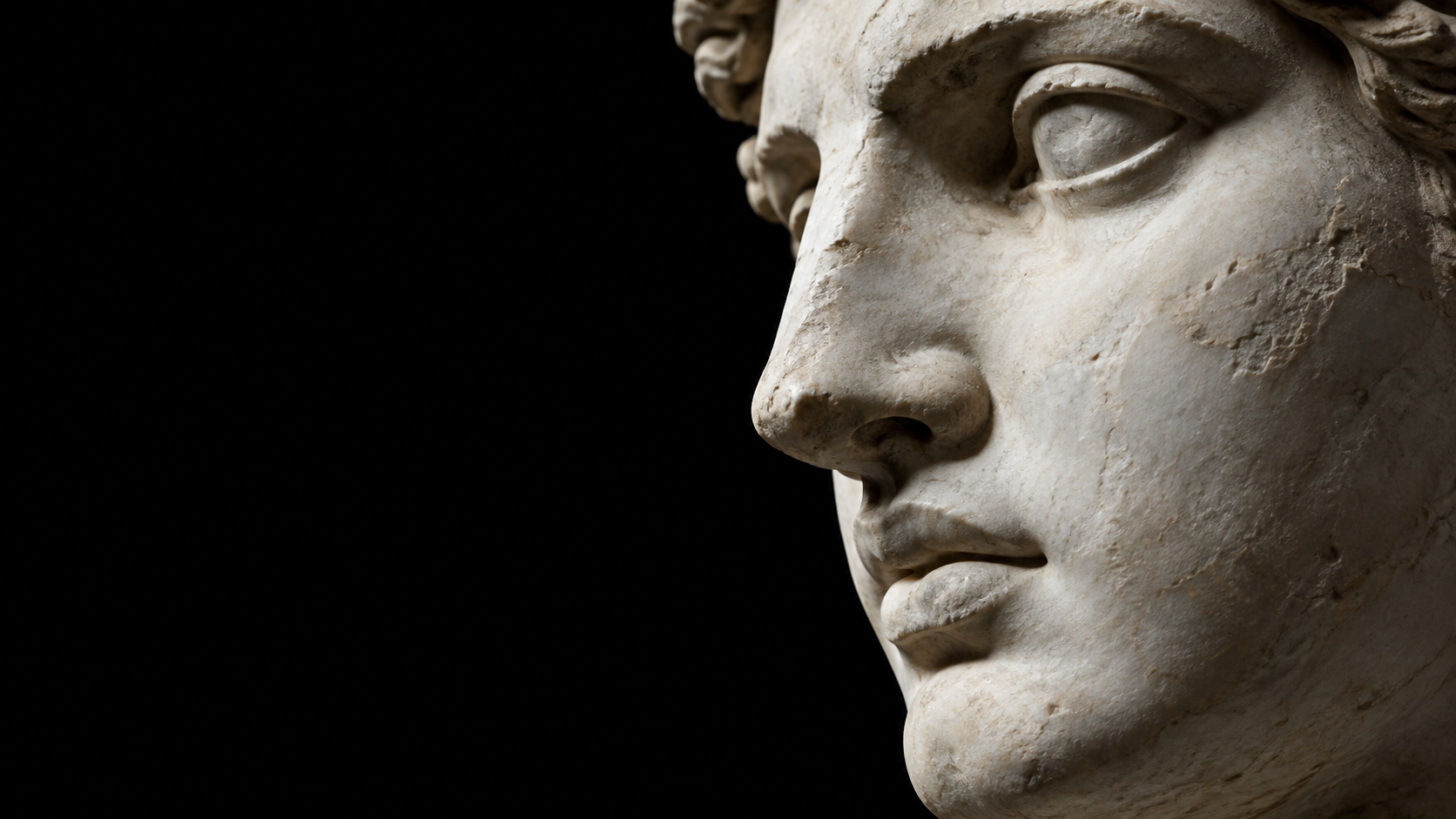 A detailed marble face emerging from darkness